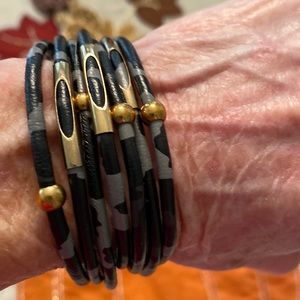 Black and gray vegan bracelet with gold magnetic closure.